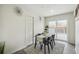 Dining room features a modern table setting and sliding glass doors leading to an outdoor deck at 3540 E 91St Ave, Thornton, CO 80229