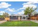Charming brick home featuring a well-maintained lawn, complemented by a spacious front yard and a cozy front porch at 3540 E 91St Ave, Thornton, CO 80229