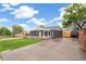 Well-lit exterior showcasing a beautifully renovated home with a spacious driveway and mature landscaping at 3540 E 91St Ave, Thornton, CO 80229