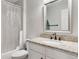 Bathroom featuring a vanity with a granite countertop and a shower with a curtain at 487 Oxbow Dr, Brighton, CO 80601