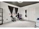 Bedroom featuring black ceiling, ample carpet and closet space at 487 Oxbow Dr, Brighton, CO 80601