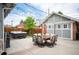 Inviting backyard space with a hot tub, dining set, grill, and fence, creating an ideal outdoor living area at 1532 Meade St, Denver, CO 80204