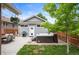 Private backyard featuring a hot tub, patio area, and lush greenery, perfect for relaxation and entertaining at 1532 Meade St, Denver, CO 80204
