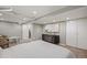 Basement bedroom features white brick wall, built in closet and updated flooring at 1532 Meade St, Denver, CO 80204