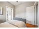 A bedroom featuring hardwood floors and a walk-in closet with built-in storage at 1532 Meade St, Denver, CO 80204
