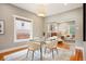 Bright dining room with a modern table set and hardwood floors, seamlessly connecting to the living area at 1532 Meade St, Denver, CO 80204