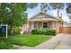 Attractive home with a well-maintained lawn, a cozy front porch, and a 'Coming Soon' sign, showcasing real estate opportunity at 1532 Meade St, Denver, CO 80204