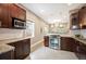 Modern kitchen featuring stainless steel appliances, granite countertops and a center island at 1532 Meade St, Denver, CO 80204
