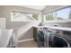 Bright laundry room featuring a side by side washer and dryer with natural light at 1532 Meade St, Denver, CO 80204