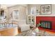 Cozy living room with a fireplace, hardwood floors, and an open layout, creating a warm and inviting atmosphere at 1532 Meade St, Denver, CO 80204