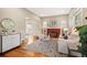 Bright and spacious living room with hardwood floors, a fireplace, and a comfortable seating area at 1532 Meade St, Denver, CO 80204
