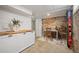 Basement storage room with brick walls, utility sink, counter space, and ski storage at 1532 Meade St, Denver, CO 80204