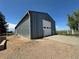 Spacious metal garage with a white door and concrete driveway, perfect for storage or a workshop at 1685 E 160Th Ave, Broomfield, CO 80023