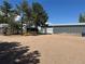 Property features a large outbuilding with a roll-up door and ample parking space at 1685 E 160Th Ave, Broomfield, CO 80023