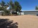 Property features a large outbuilding with a roll-up door and ample parking space at 1685 E 160Th Ave, Broomfield, CO 80023