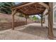 The backyard features a covered patio and retaining wall perfect for entertaining and relaxation at 4214 Kestrel Pl, Castle Rock, CO 80109