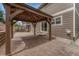 Backyard featuring a covered patio with views of the house, great for outdoor relaxation at 4214 Kestrel Pl, Castle Rock, CO 80109