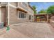 Exterior backyard view shows the home, covered patio, and terraced landscaping at 4214 Kestrel Pl, Castle Rock, CO 80109