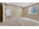 Carpeted basement with a window and door opening to another room at 4214 Kestrel Pl, Castle Rock, CO 80109
