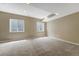 Finished basement features neutral carpeting, recessed lighting, and an egress window at 4214 Kestrel Pl, Castle Rock, CO 80109