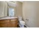 Half bath with vanity, sink, and toilet at 4214 Kestrel Pl, Castle Rock, CO 80109