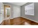 Bedroom featuring hardwood floors, neutral walls, and a double door closet at 4214 Kestrel Pl, Castle Rock, CO 80109