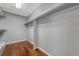 Walk-in closet with hardwood flooring and hanging rods for ample storage at 4214 Kestrel Pl, Castle Rock, CO 80109