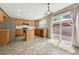 Bright kitchen featuring stainless steel appliances, island, and sliding glass door to the backyard at 4214 Kestrel Pl, Castle Rock, CO 80109