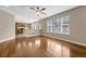 Living room leads into the kitchen and has hardwood floors throughout at 4214 Kestrel Pl, Castle Rock, CO 80109