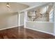 Open-concept living area showcases hardwood floors, staircase, and neutral paint at 4214 Kestrel Pl, Castle Rock, CO 80109
