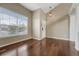 Spacious living room features hardwood floors, ample natural light, and neutral colored walls at 4214 Kestrel Pl, Castle Rock, CO 80109
