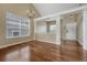 Open floor plan offers hardwood floors, columns, and neutral colored walls at 4214 Kestrel Pl, Castle Rock, CO 80109