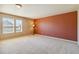 Bright, spacious bedroom with ample natural light, neutral walls, and plush carpeting, perfect for relaxation at 12766 Jasmine St # D, Thornton, CO 80602