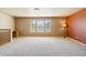 Expansive bedroom featuring neutral walls, carpeted floors, and large windows that illuminate with natural light at 12766 Jasmine St # D, Thornton, CO 80602