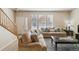Comfortable living room featuring neutral decor, plush sofas, and ample natural light, creating a relaxing atmosphere at 12766 Jasmine St # D, Thornton, CO 80602