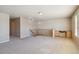 Spacious loft area features built-in desk, ample natural light, and neutral carpet flooring at 12766 Jasmine St # D, Thornton, CO 80602
