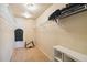 Organized walk-in closet with shelves, hanging rods, and carpet flooring at 12766 Jasmine St # D, Thornton, CO 80602
