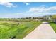 Well maintained community walking path with green space, grass, and landscaping at 12766 Jasmine St # D, Thornton, CO 80602