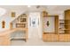 A carpeted hallway with custom wood shelving and storage has an adjacent desk area at 506 N Marion St, Denver, CO 80218