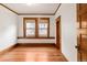 Empty bedroom with wood floors, trim, neutral paint, and lots of natural light at 506 N Marion St, Denver, CO 80218