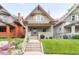 Charming two-story home with a front porch and beautifully landscaped yard at 506 N Marion St, Denver, CO 80218
