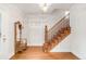 Inviting foyer featuring hardwood floors, a charming staircase, and stained glass windows at 506 N Marion St, Denver, CO 80218