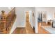 Foyer featuring wood floors, a staircase, and views of the dining and living rooms at 506 N Marion St, Denver, CO 80218