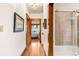 Hallway with hardwood floors leading to a bedroom and a bathroom at 506 N Marion St, Denver, CO 80218