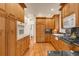 Spacious kitchen with custom wood cabinets, granite countertops, and modern appliances at 506 N Marion St, Denver, CO 80218