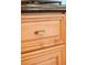 Close up of a kitchen cabinet featuring detailed gold hardware and a dark countertop at 506 N Marion St, Denver, CO 80218