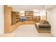 Spacious living room has an entire wall of custom storage, shelving, and a comfortable sofa at 506 N Marion St, Denver, CO 80218