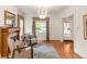 Elegant living room with hardwood floors, a fireplace, and natural light from the large window at 506 N Marion St, Denver, CO 80218