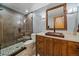 Nicely designed bathroom with a modern glass shower and a unique copper sink at 6080 Kilimanjaro Dr, Evergreen, CO 80439