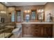 Bathroom featuring double sinks, a walk-in shower, and a tiled floor at 6080 Kilimanjaro Dr, Evergreen, CO 80439